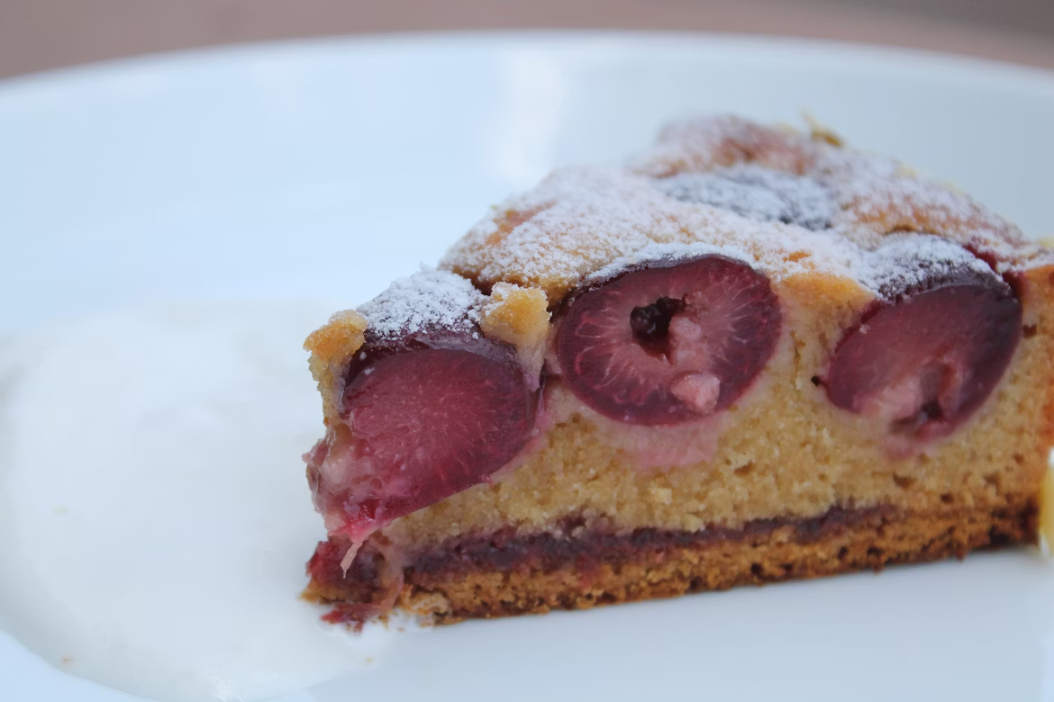 Walnut raspberry torte squares with raspberry sauce