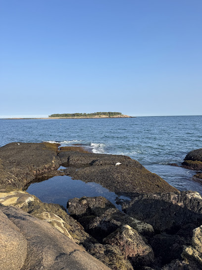 Coolidge Reservation rocky point granite cliffs looking over the bay