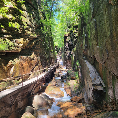 Flume Gorge towering granite walls and wooden boardwalk trail