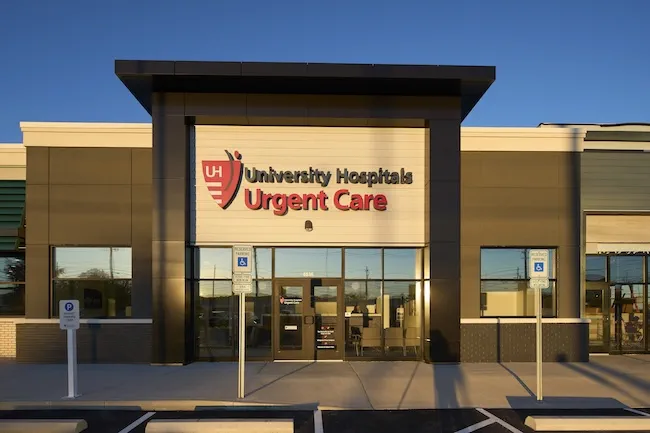 Medical cross symbol and urgent care building entrance in Syracuse NY