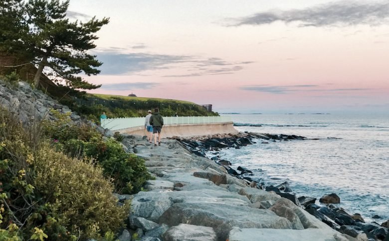 Oceanfront walking path along pink granite ledges and crashing Atlantic surf