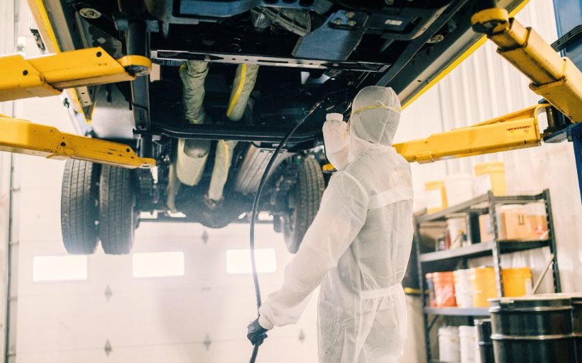 Applying anti-corrosive fluid barrier protection to truck frame rails