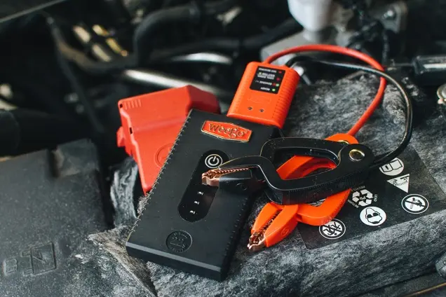 Winter vehicle jump starter pack and jumper cables for sub-zero cold starts